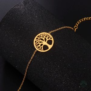 Bijou doré représentant l'arbre de vie sur bracelet en acier